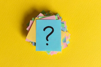 colorful question marks written reminders tickets. ask or business concept.
