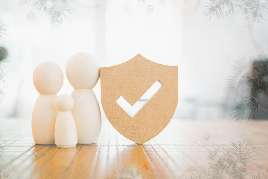 Image of a wooden toy family on a table next to a checkmark symbol